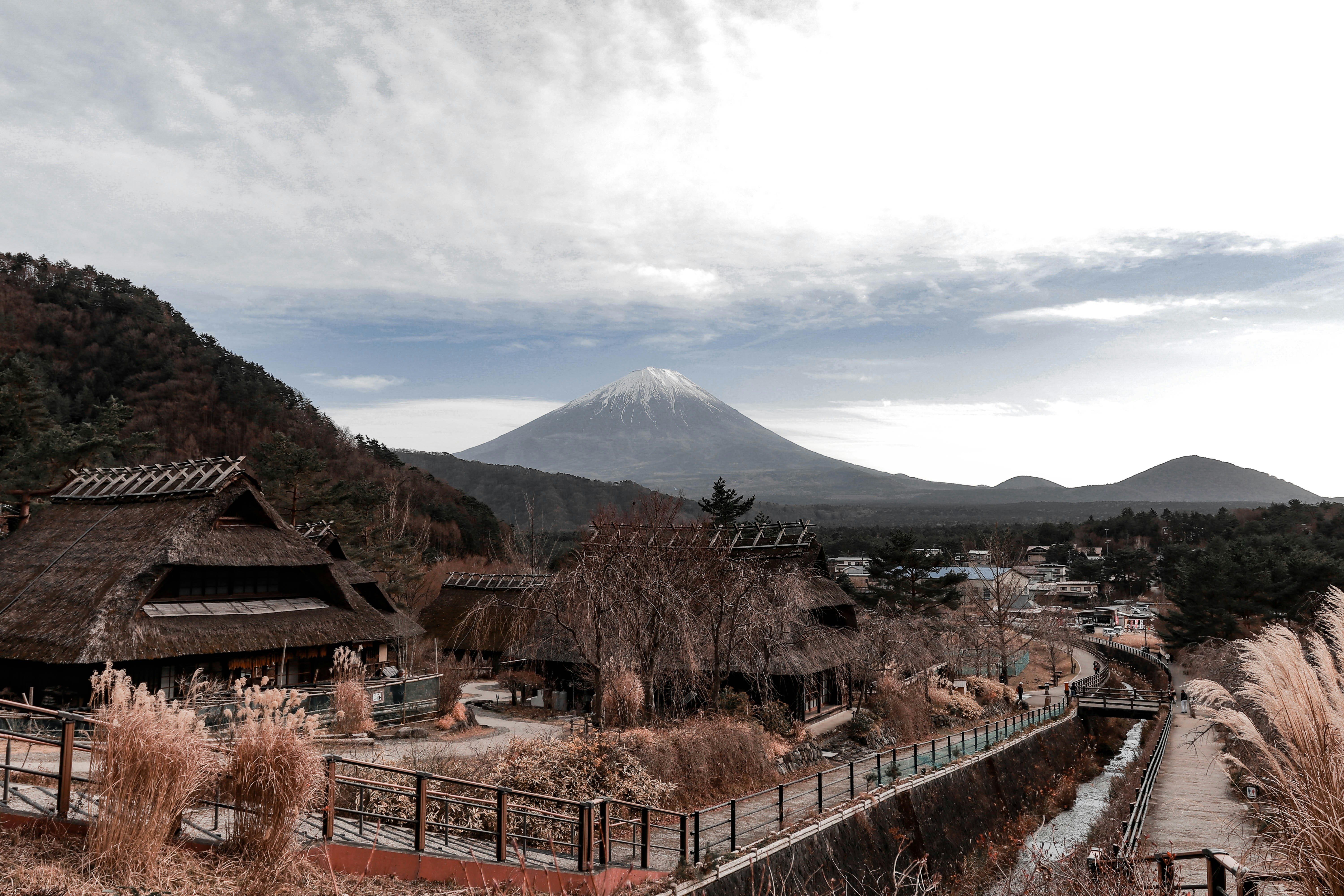 Saiko Iyashino Sato Nemba, a collection of traditional thatched-roof houses (Gasshō-zukuri) with Mount Fuji in the background